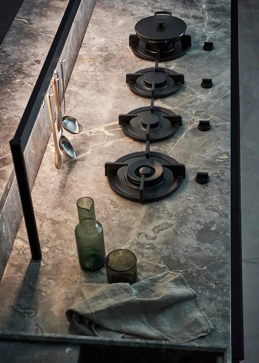 Stone craftsman inspecting a large slab